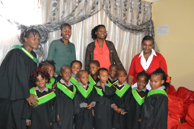 the graduates with their teachers, principal and a guest from the department of education who came
